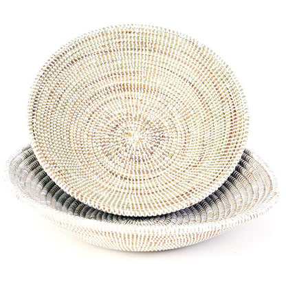 Stack of woven baskets on a white background