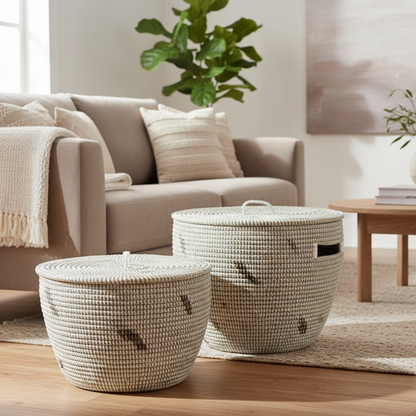 Two woven baskets with decorative patterns on a white background