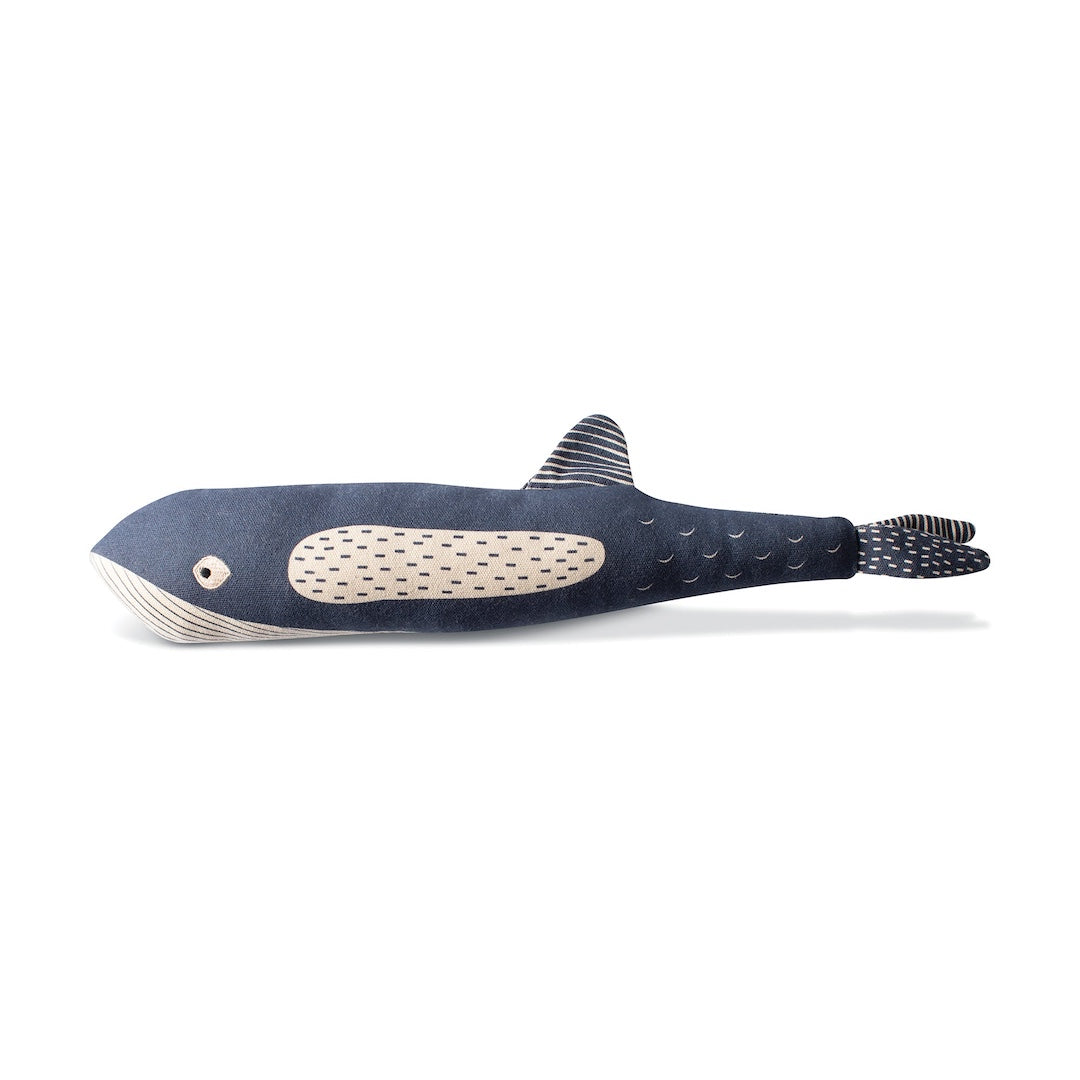 Whale shaped dog toy on a white background