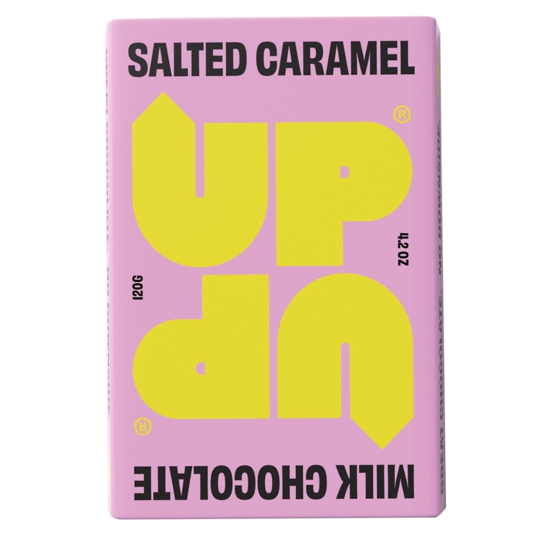 Pink packaging of UP UP salted caramel milk chocolate with yellow text on a white background