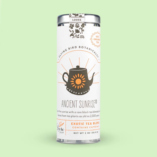 Tea canister labeled 'Ancient Sunrise' on a light green background
