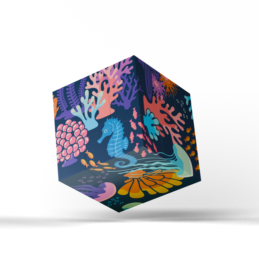 A floating cube-shaped product with a stylized underwater illustration featuring bright coral and seahorses, shown on a clean white background with a soft shadow underneath.