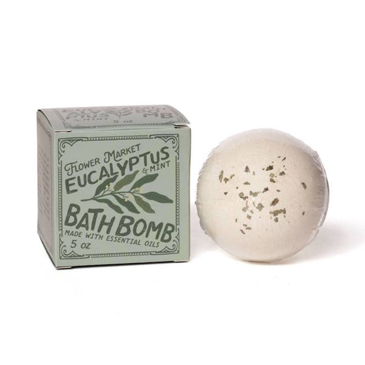 Bath bomb with packaging labeled 'Eucalyptus & Mint' on a white background