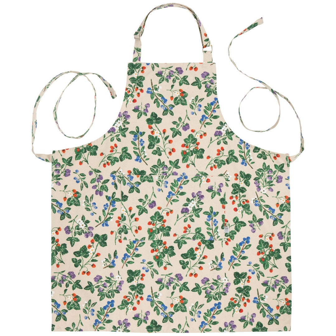 White apron with a berry bush pattern on it on a white background 