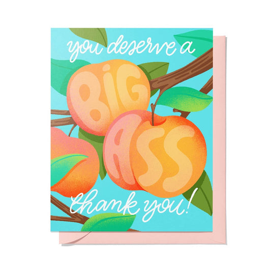 A square greeting card with a pink envelope, featuring an illustration of three peaches on a branch with green leaves against a light blue background. White script text reads 'you deserve a BIG ASS thank you!'.