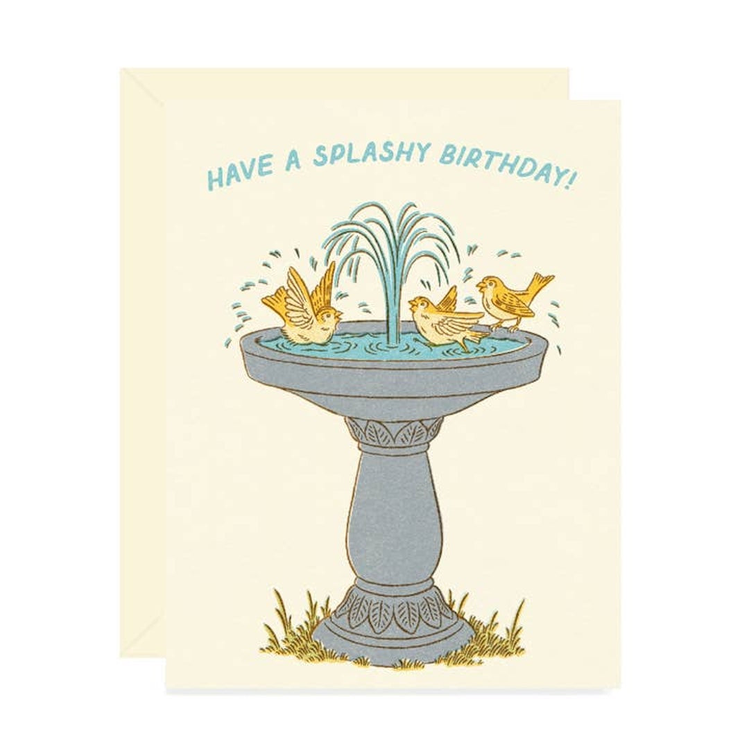 Birthday card with birds around a fountain and text 'Have a Splashy Birthday!' on a beige background.