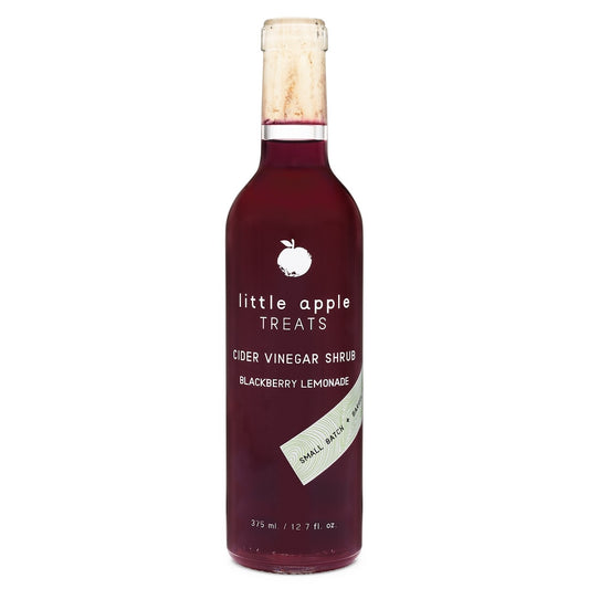 Bottle of 'little apple treats' cider vinegar blackberry lemonade flavored shrub on a white background