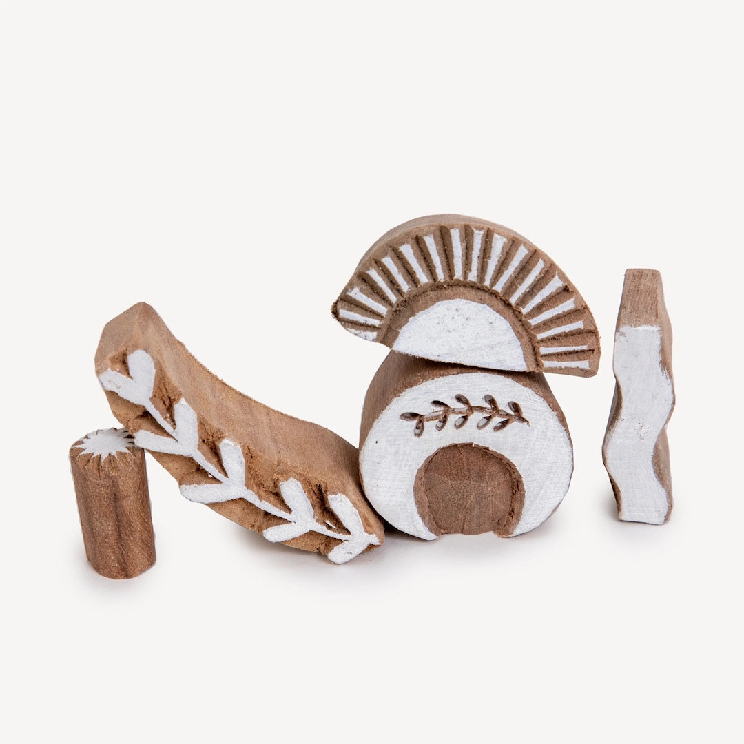 wood carved stamps. shapes include a Moon, Sun, Star, Plant and Wave