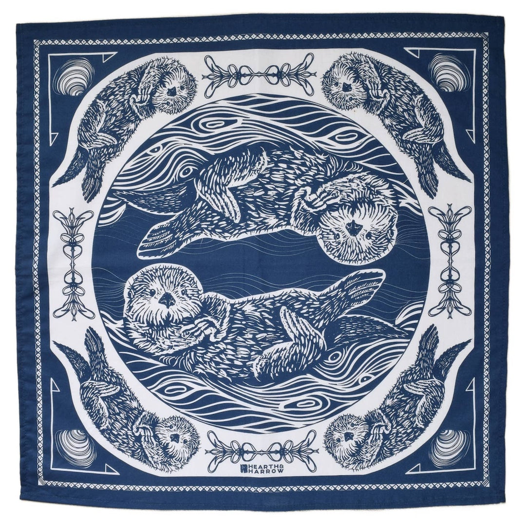 Navy blue and white bandana with otter design on a white background