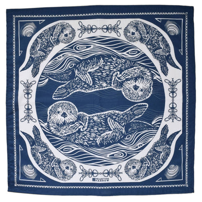 Navy blue and white bandana with otter design on a white background