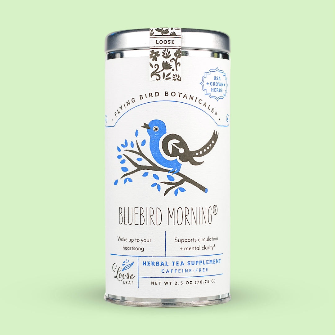 Tea canister labeled 'Bluebird Morning' with branding on a light green background