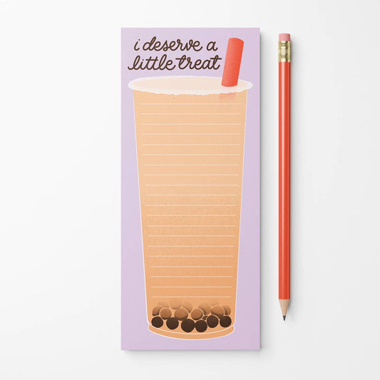 A lavender notepad with a lined bubble tea drawing and the text 'i deserve a little treat' next to a red pencil on a white background.