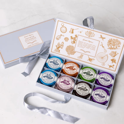 Set of shower steamers in a branded box on a white background