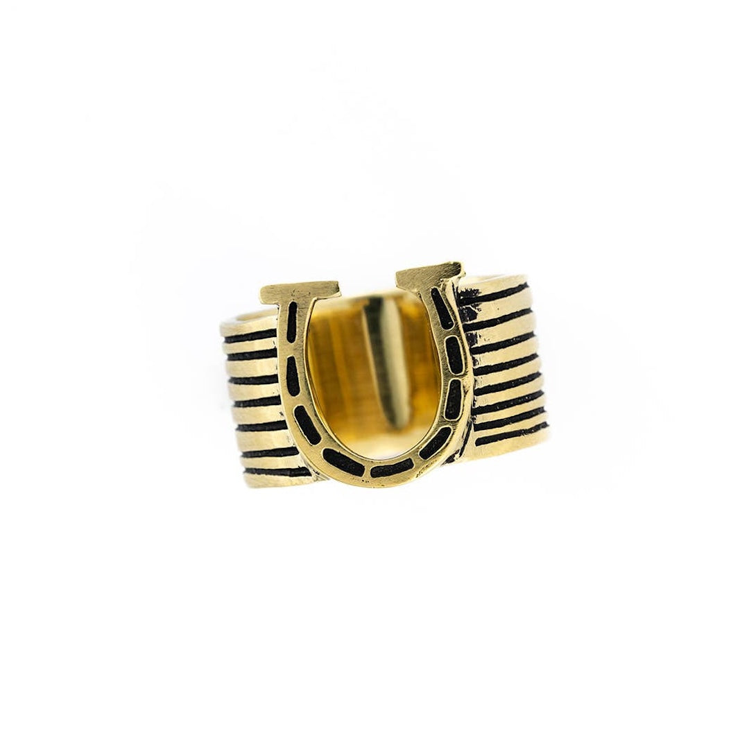 Brass bandana slide ring with a horseshoe on it