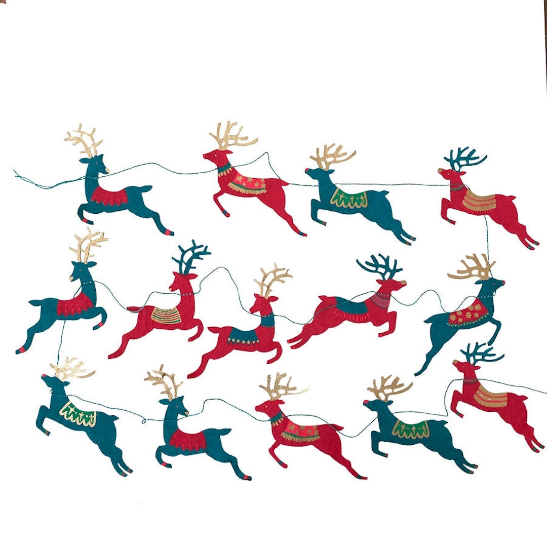 A festive Christmas garland featuring stylized reindeer with alternating teal and red reindeer wearing gold and green patterned harnesses, on a plain white background.