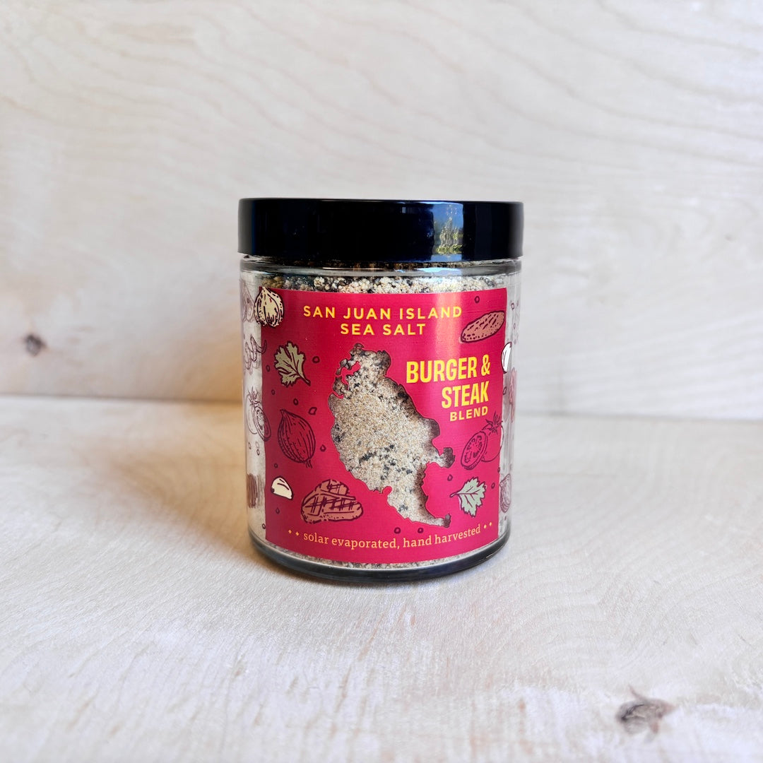 Jar of San Juan Island Sea Salt Burger & Steak Blend on a wooden surface