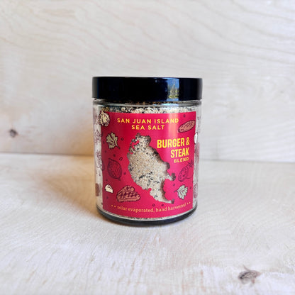Jar of San Juan Island Sea Salt Burger & Steak Blend on a wooden surface