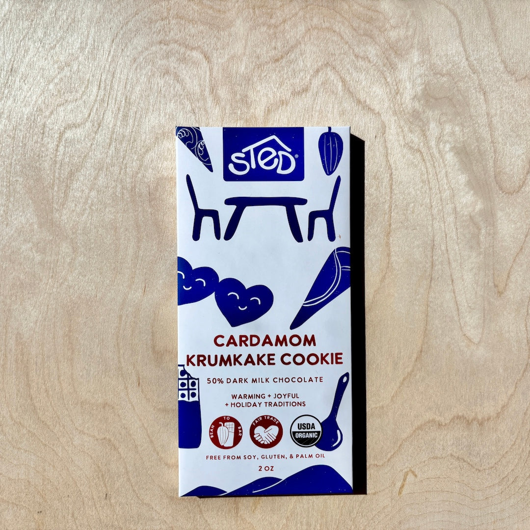 STED cardamom krumkake cookie chocolate bar  in packaging on a wooden surface