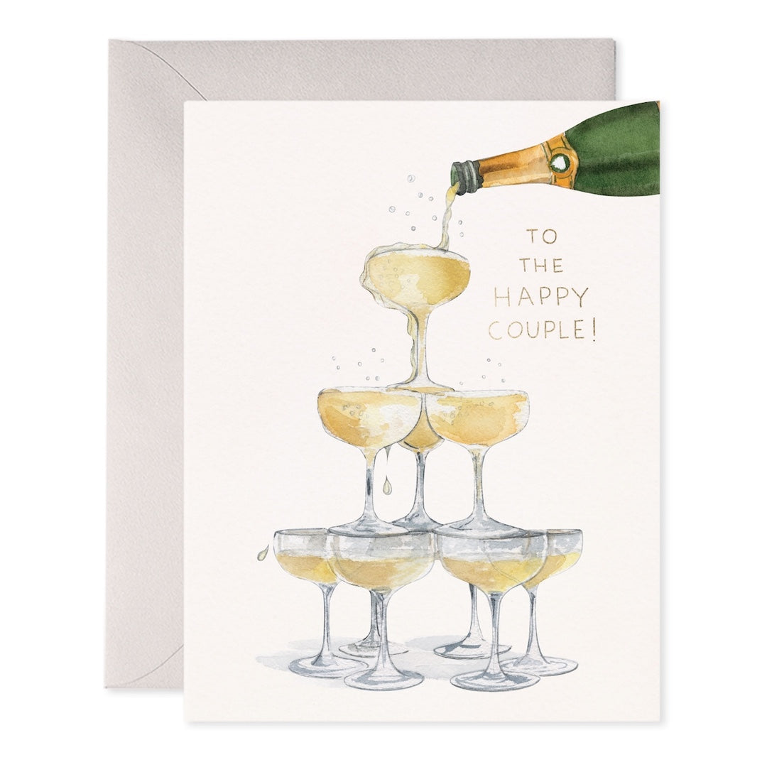Greeting card with champagne bottle pouring into a tower of champagne glasses, 'To the Happy Couple!' text, on a white background.