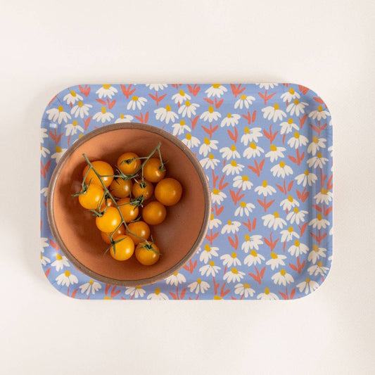 Bowl of yellow tomatoes on a floral-patterned tray