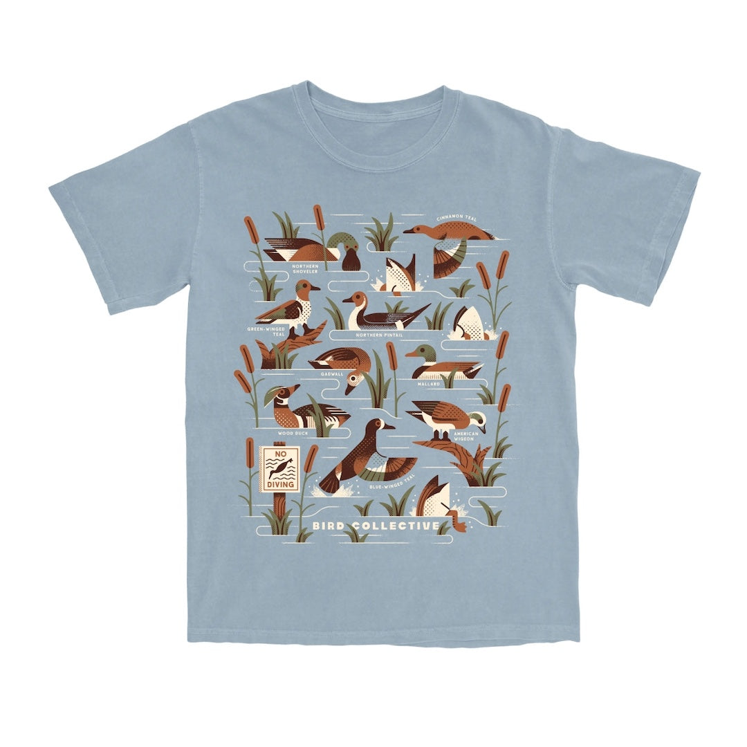 Light blue t-shirt with duck illustrations on a white background