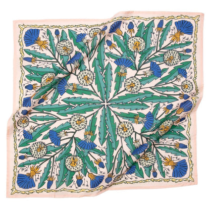 Light pink bandana with dandelions and other flowers on it
