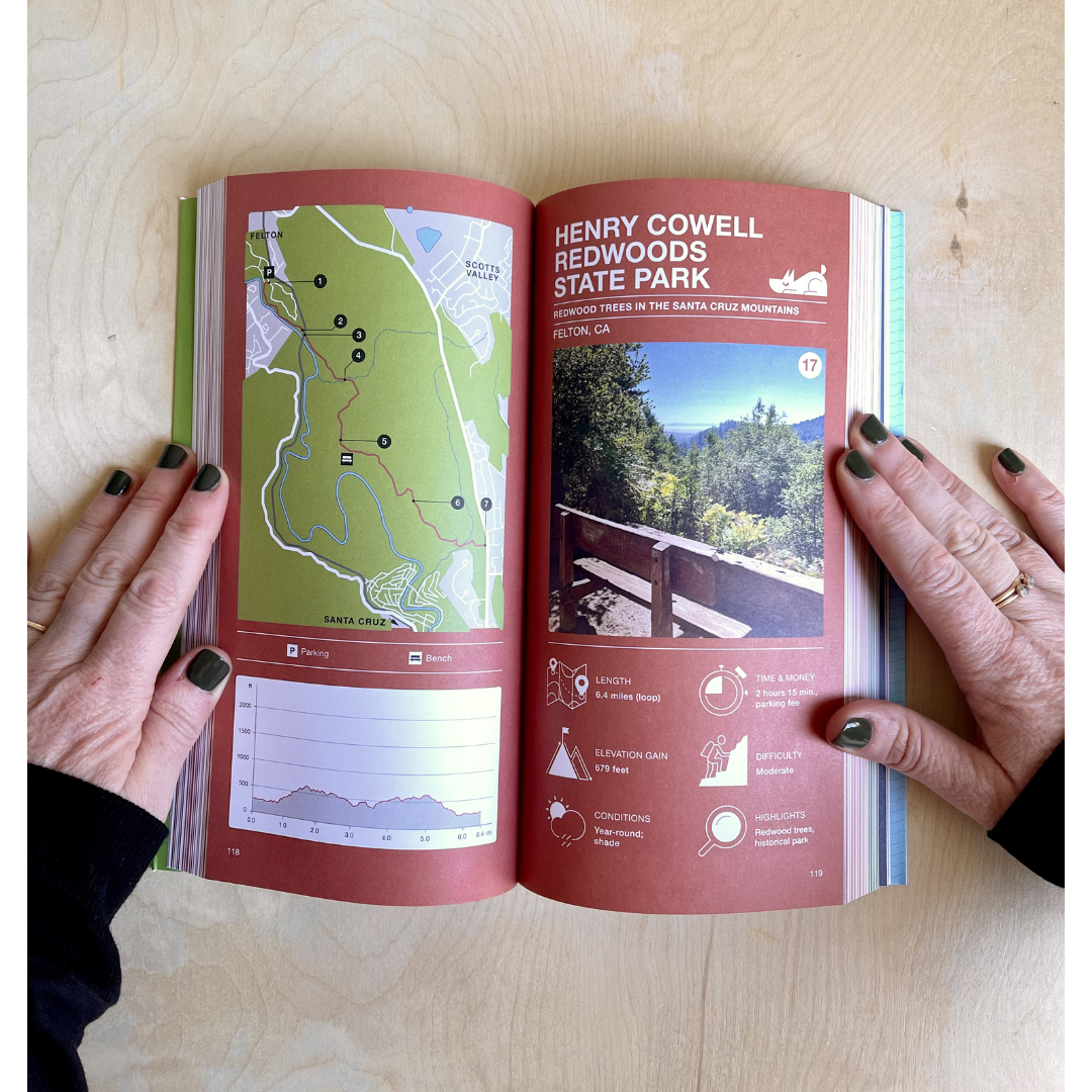 Open book showing a map and images of Henry Cowell Redwoods State Park on a wooden surface.