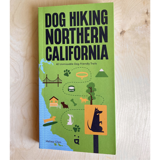 Book titled 'Dog Hiking Northern California' on a wooden surface