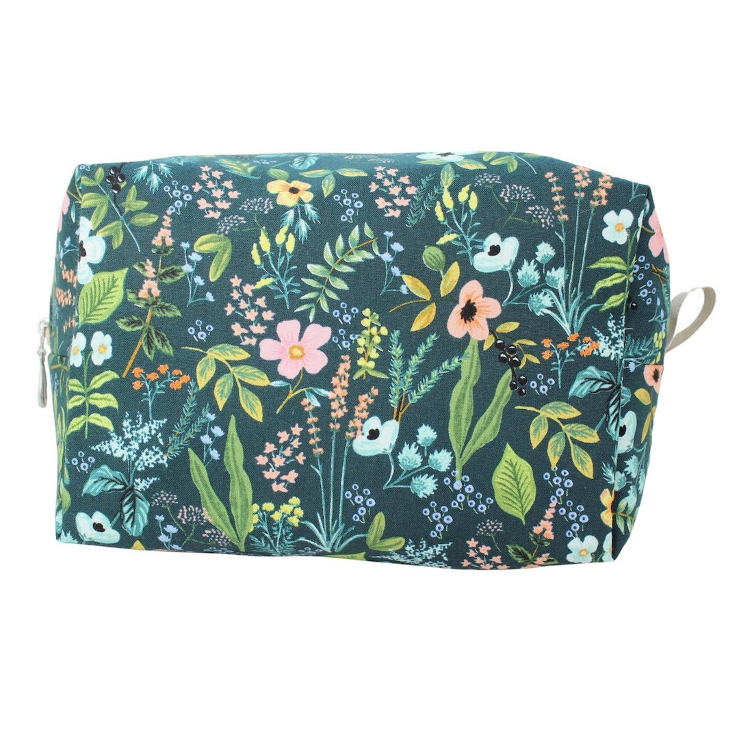 Floral patterned pouch on a white background