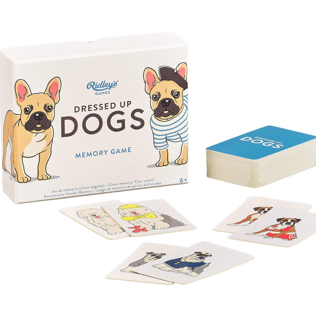 Reddy's Games Dressed Up Dogs Memory Game set, showing the white product box with illustrated French bulldogs, a stack of blue-backed cards, and several dog memory cards arranged on a white background.