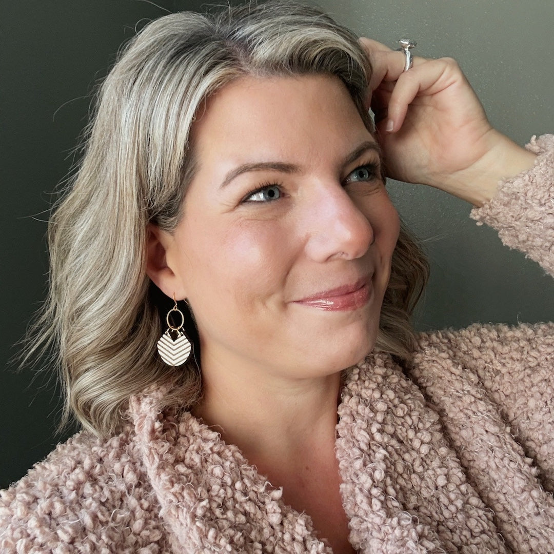 Woman wearing a pink robe with a neutral background