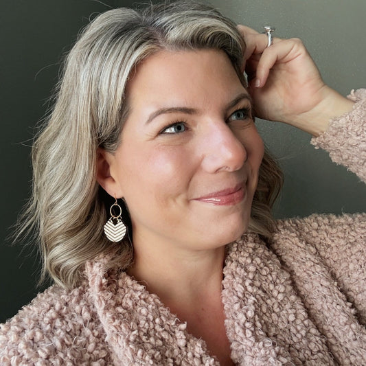 Woman wearing a pink robe with a neutral background
