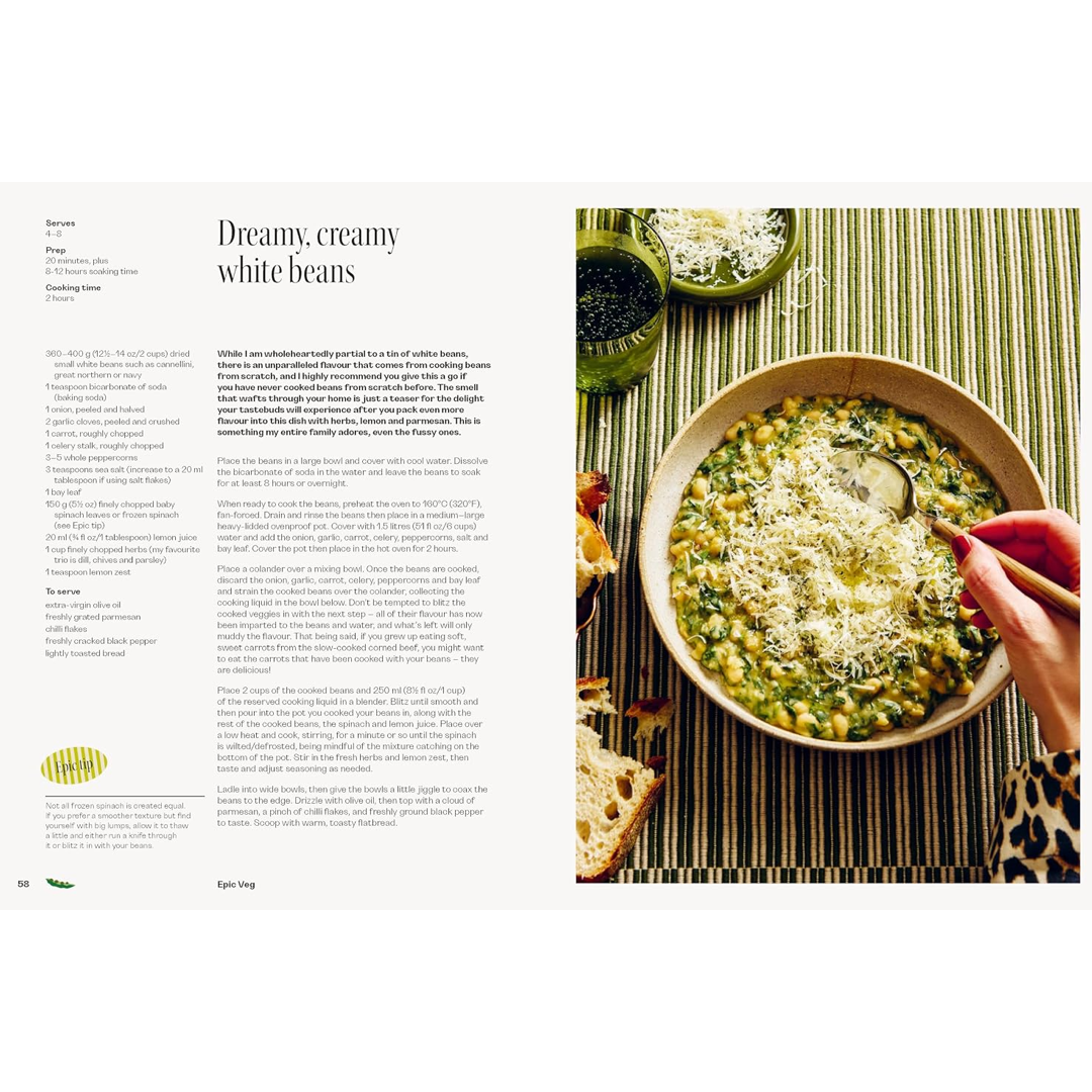 An open cookbook spread showing a recipe page titled 'Dreamy, creamy white beans' on the left and a food photograph of a bowl of white beans topped with cheese on the right.
