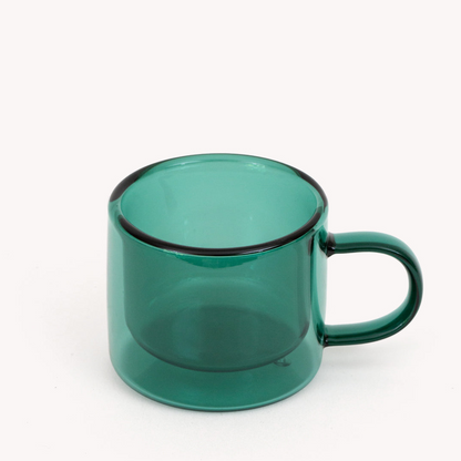 green double walled espresso cup with handle on a white background