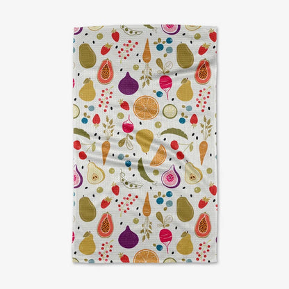 white dishtowel with a variety of fruits and vegetables on it