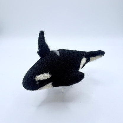 felt orca on a white background