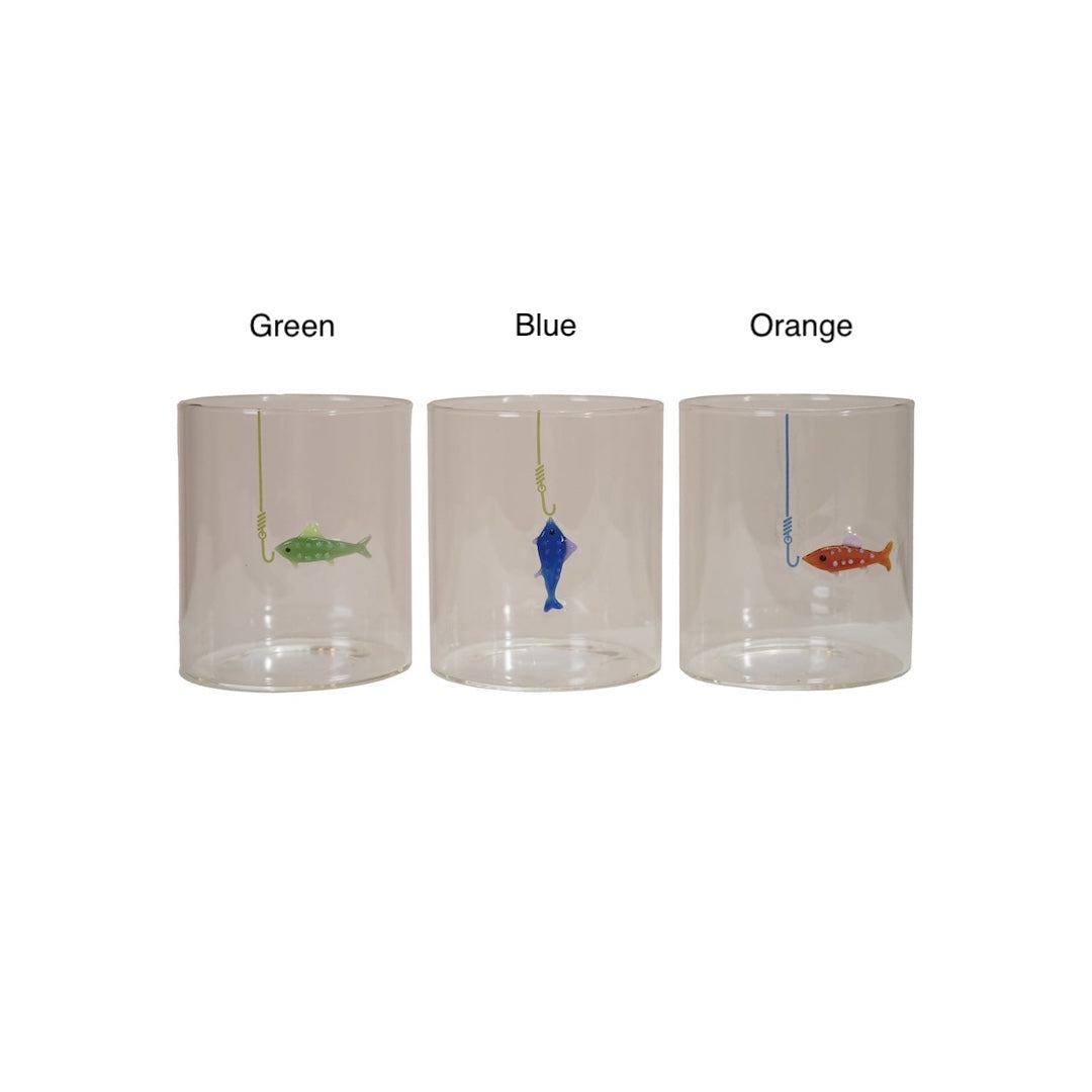 Three clear cylindrical glasses labeled Green, Blue, and Orange, each containing a small hanging fish in a different color, shown on a white background.