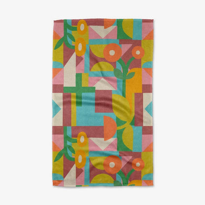 Colorful geometric patterned towel on a white background