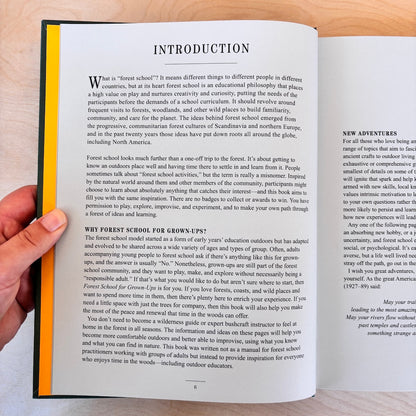 An open book showing the 'Introduction' page from its front cover, photographed against a dark background. The page has black text on a white background 