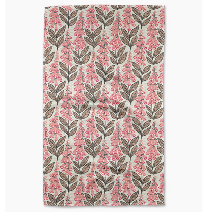 Floral patterned towel with pink flowers and brown leaves on a white background