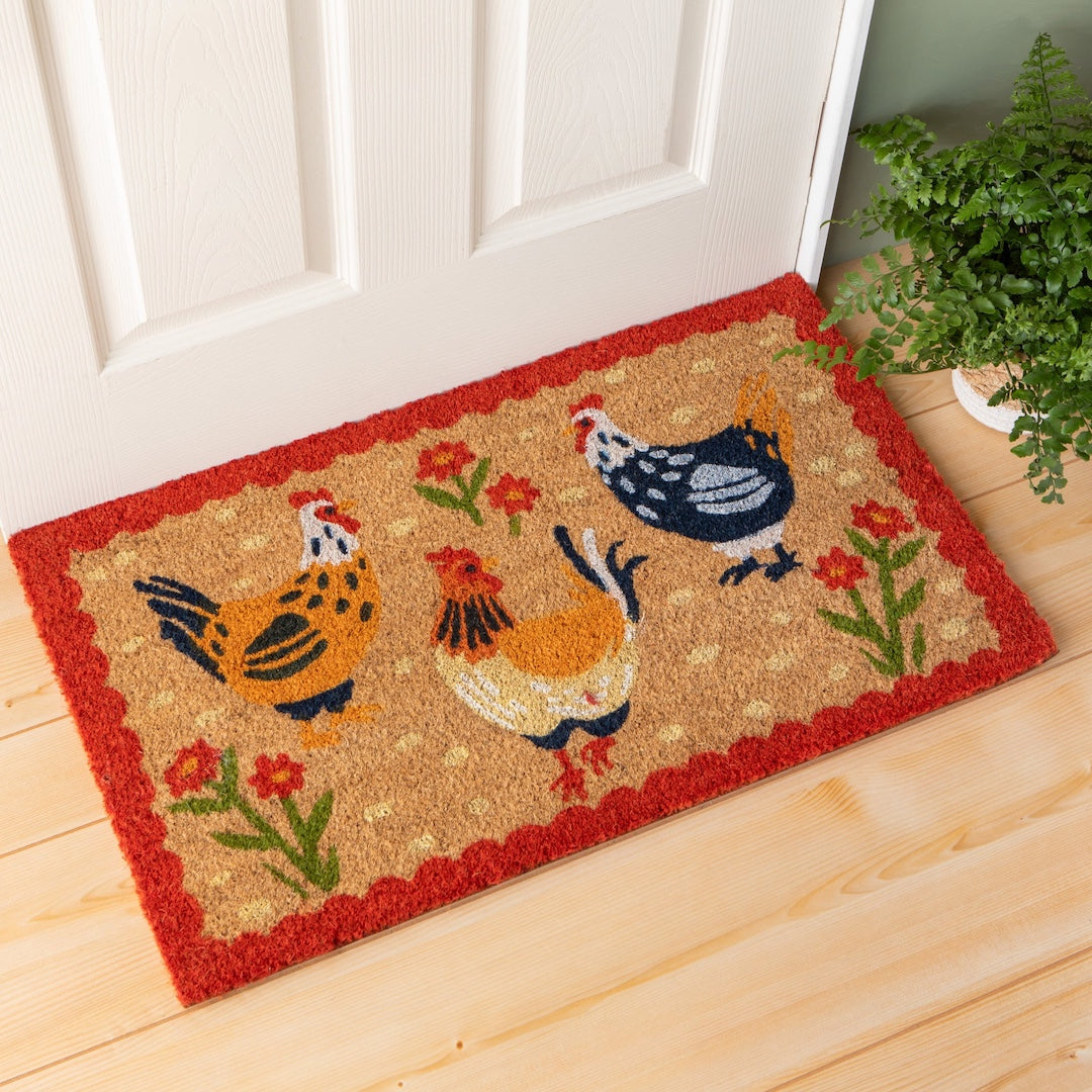 Doormat with chicken design on a wooden floor