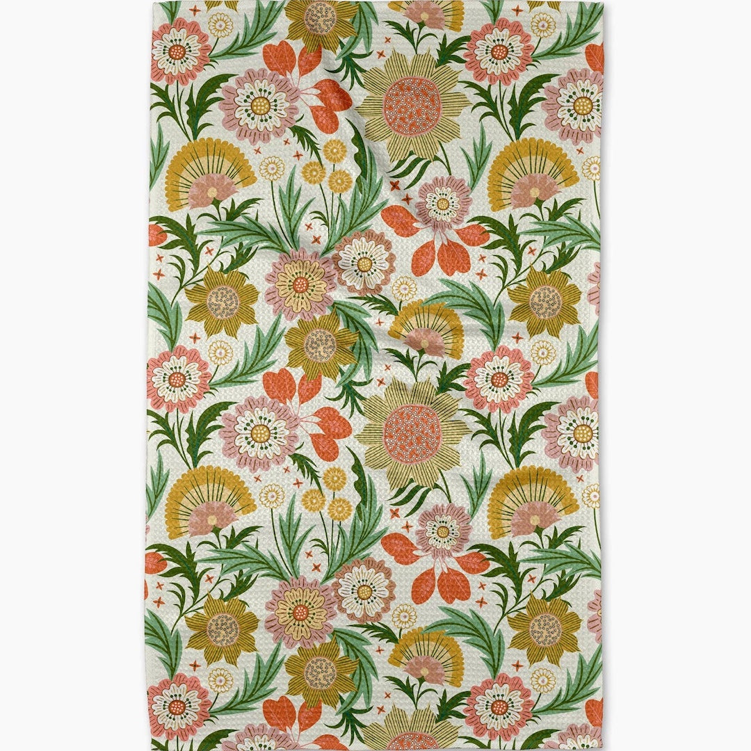 dishtowel with a bright floral pattern on a white background