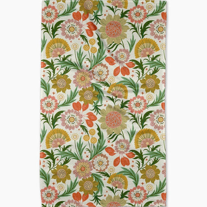 dishtowel with a bright floral pattern on a white background