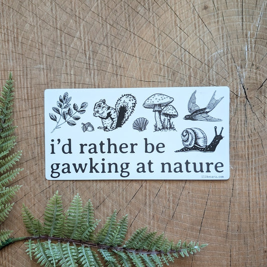 bumper sticker with nature illustrations with text that reads "I'd rather be gawking at nature"