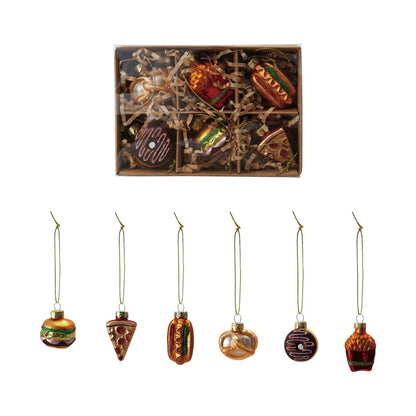six Christmas ornaments shaped like food items in a decorative box.