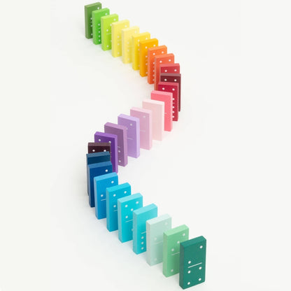 Colorful dominoes set arranged in a line on a white background