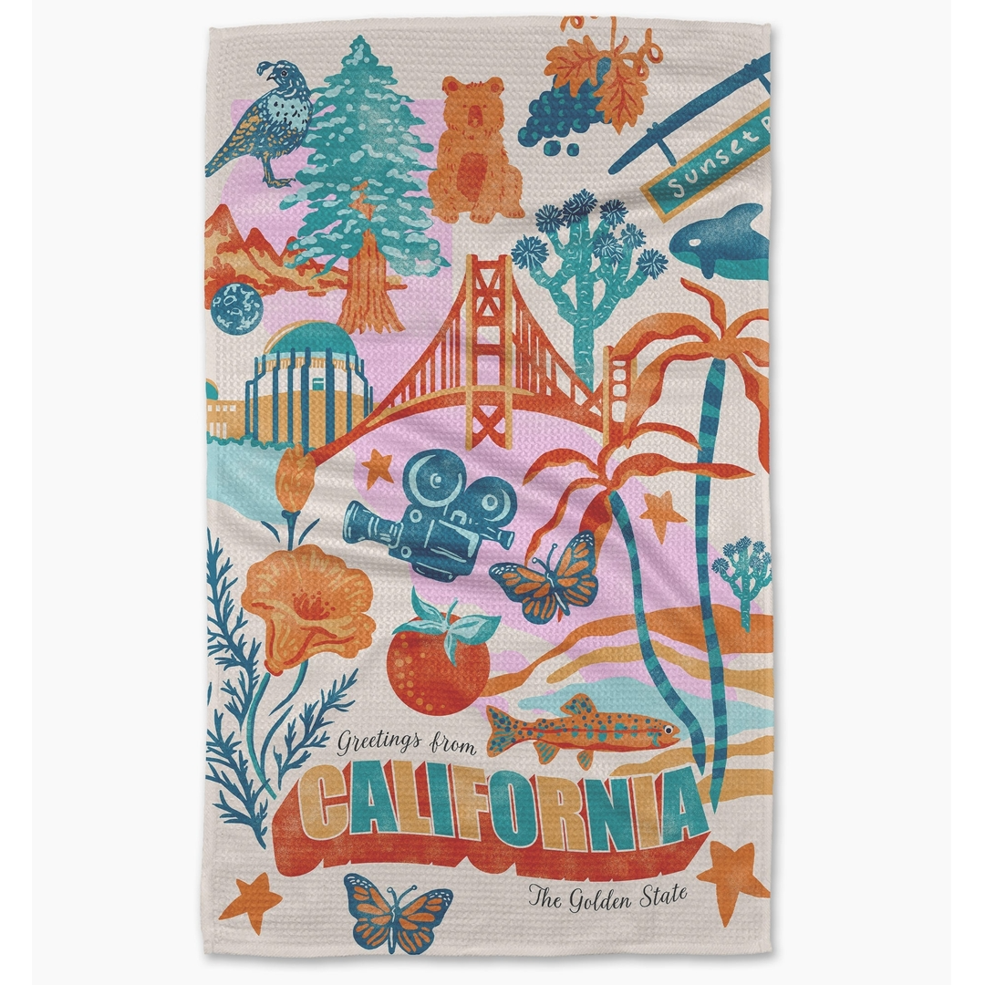 Colorful towel with California-themed designs including the Golden Gate Bridge and beach elements.