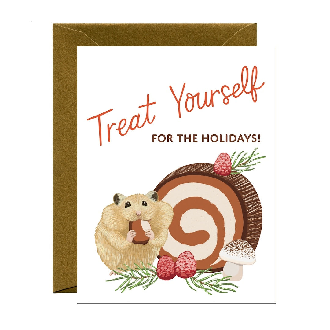 A greeting card with a white front featuring the phrase 'Treat Yourself FOR THE HOLIDAYS!' in orange and brown text, plus an illustration of a hamster beside a buche de noel dessert cake and greenery. A brown envelope is placed behind the card on a white background.