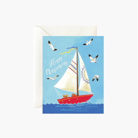 Greeting card with a sailboat and seagulls on a blue background, featuring the text 'Happy Anniversary'.