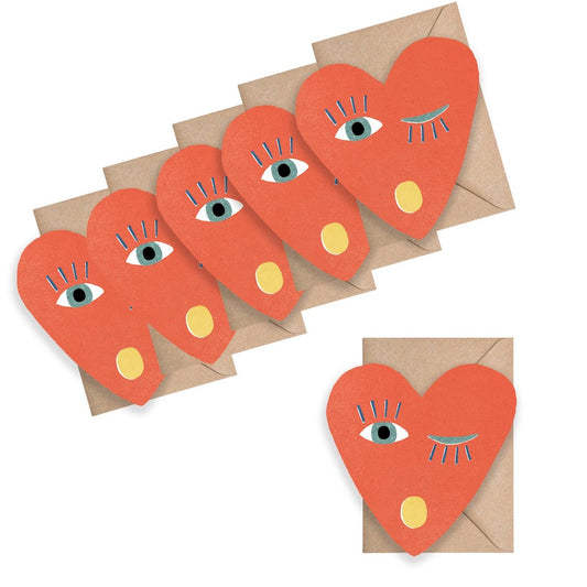 Red heart-shaped cards with face details on brown envelopes against a white background
